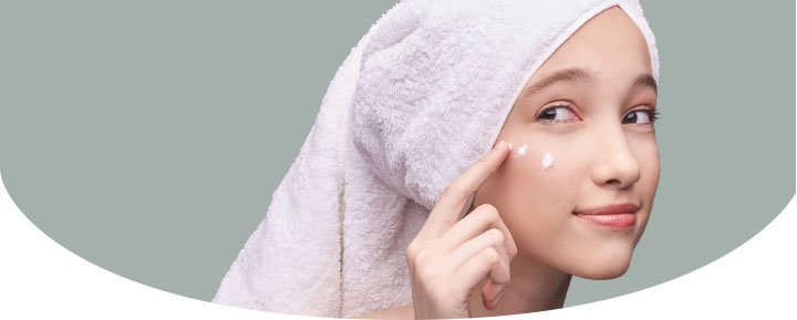 A woman with a cosmetic cream in the face